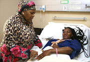 Defence Minister Nosiviwe Masipa-Nqakula visits injured soldier Delta Mahuleke in hospital.