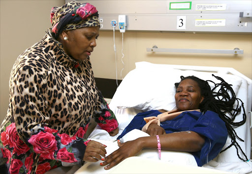 Defence Minister Nosiviwe Masipa-Nqakula visits injured soldier Delta Mahuleke in hospital.