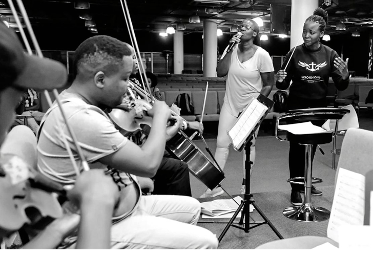 Ofentse Pitse, far right, rehearsing a number with her orchestra ensemble and with award-winning singer Judith Sephuma beside her.