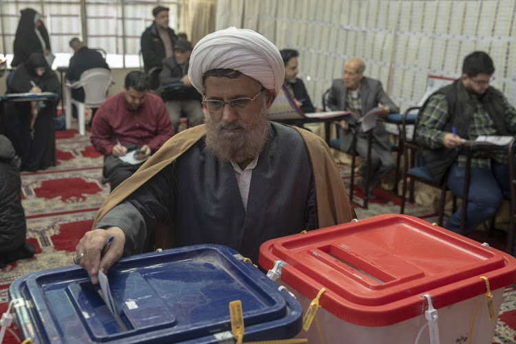 Iranian people cast their votes at a polling station in Tehran, Iran, on March 1 2024. Picture: MAJID SAEED/GETTY IMAGES