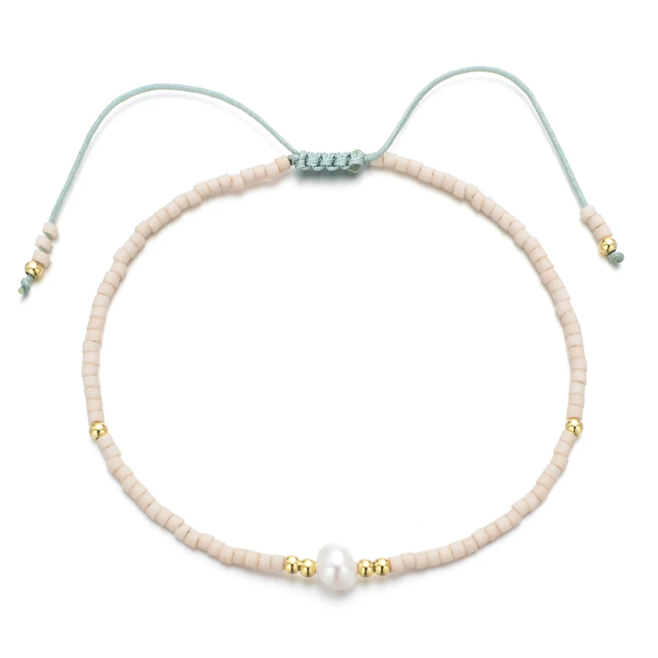 Handgeweven armband met natuurlijke parels. Elegant en tijdloos sieraad. De perfecte cadeau-optie. Uniek design en hoogwaardige materialen.