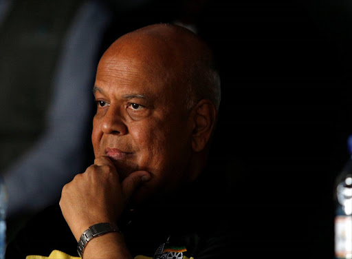 Former Finance Minister Pravin Gordhan reacts as African National Congress Youth League members interrupt a memorial service for anti-apartheid activist Ahmed Kathrada in Durban, South Africa, April 9, 2017. REUTERS/Rogan Ward