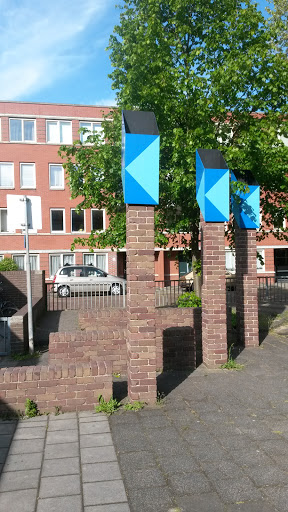 Three Poles With Blue Heads