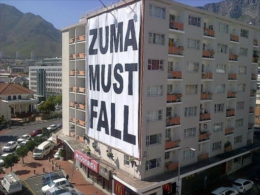 Image shared on Twitter by Ian Bredenkamp‏@IanBredenkamp captioned "Someone with big balls & deep pockets put this billboard up in Long st #CapeTown today #ZumaMustFall via @theKLIQUE"