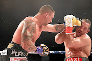 Kevin Lerena lands a punch onto Firat Arslan's head  during their IBO World Championship cruiserweight title fight  in Germany at the weekend. /  Getty Images / Alex Grimm