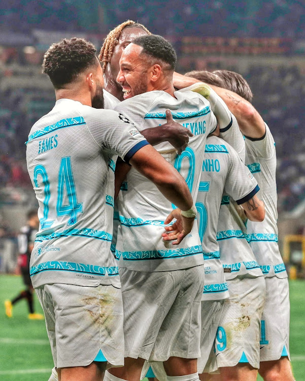Pierre-Emerick Aubameyang celebrates with teammates after scoring against AC Milan