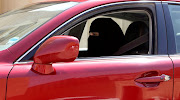 A woman drives a car in Riyadh, Saudi Arabia on October 22, 2013. 