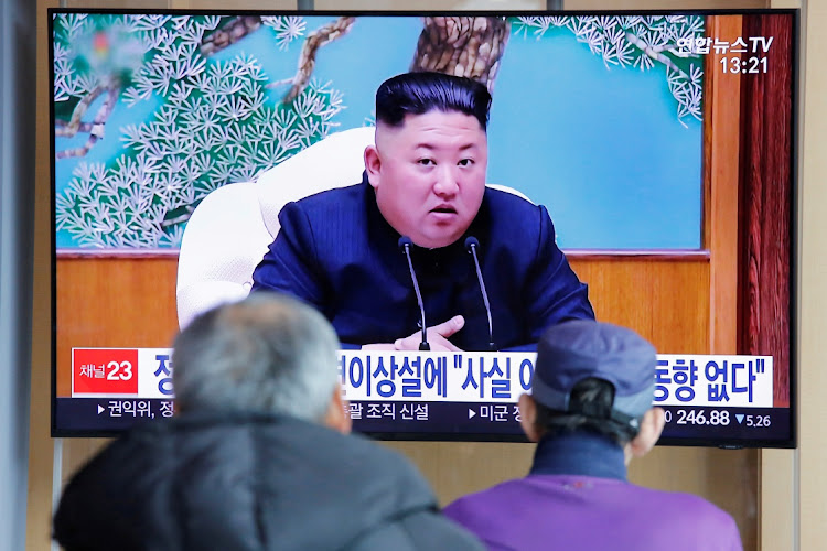 South Korean people watch a TV broadcasting a news report on North Korean leader Kim Jong Un in Seoul, South Korea.