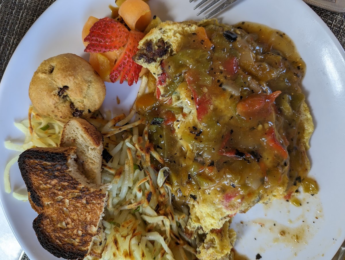 Omelet smothered in green chile.