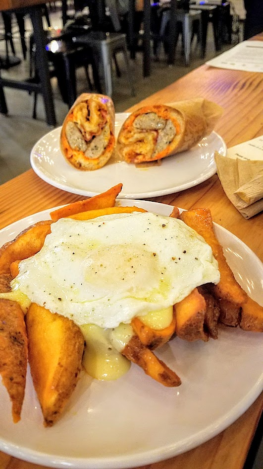 Brunch at Pine Street Market includes Pollo Bravo with their Potatoes Bravas with Sunny Side Egg