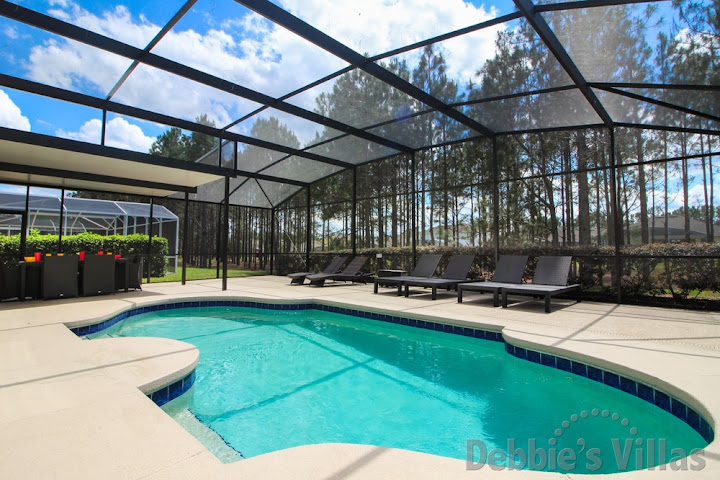 Extended west-facing pool deck with woodland view on Highlands Reserve