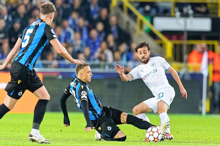 Noa Lang of Club Brugge KV competes for the ball with Bernardo Silva of Manchester City during the UEFA Champions League group A match between Club Brugge KV and Manchester City at Jan Breydel Stadium on October 19, 2021 in Brugge, Belgium.