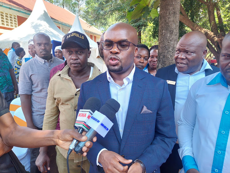 Interior Principal Secretary Dr. Raymond Omolo addressing the media at Migosi Adventist Church In Kisumu on May 18, 2024