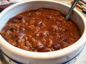 Add cheddar cheese, sour cream and green onions to top off this chili.