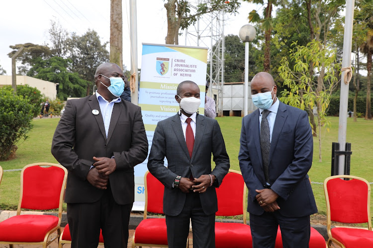 CJAK chairperson Dominic Wabala, ICT CS Joe Mucheru and DCI boss George Kinoti during the launch of crime journalists association at DCI headquarters.