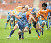 Francois Hougaard of the Bulls shows his Cheetahs pursuers a clean pair of heels during a pre-season friendly Picture: GALLO IMAGES