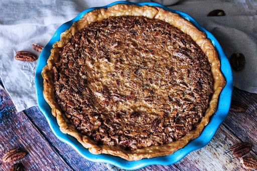 Bourbon Cheesecake Pecan Pie ready to be sliced.