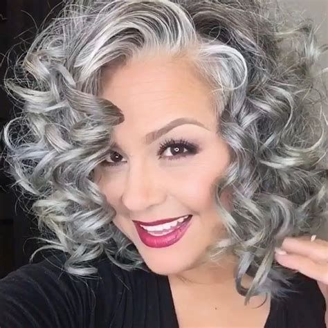 smiling lady flaunting her grey hairstyle