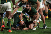 Cobus Reinach of the Springboks congratulates try-scorer Malcolm Marx during the Rugby Championship match against  Argentina at Nelson Mandela Bay Stadium in Gqeberha on August 21, 2021.