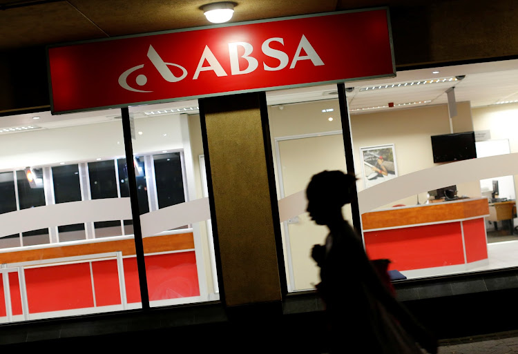 A woman walks past a branch of Barclay's South African subsidiary Absa bank in Cape Town, on March 1, 2016. File Photo