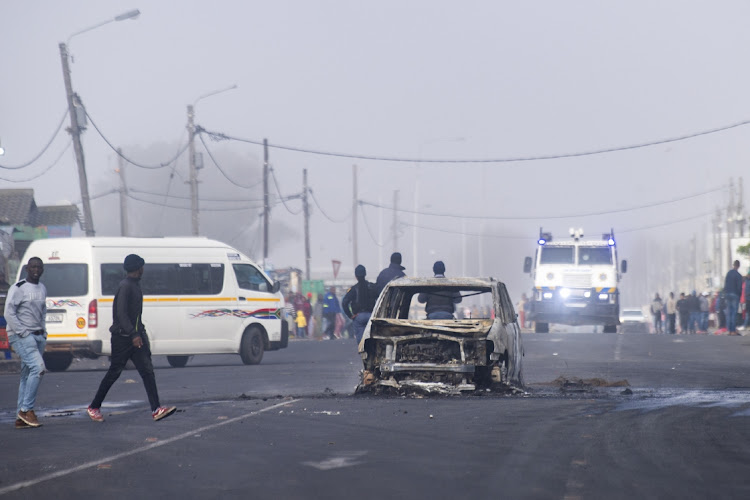 A vehicle that was set on fire in Nyanga on day five of the minibus taxi strike in Cape Town. File photo.