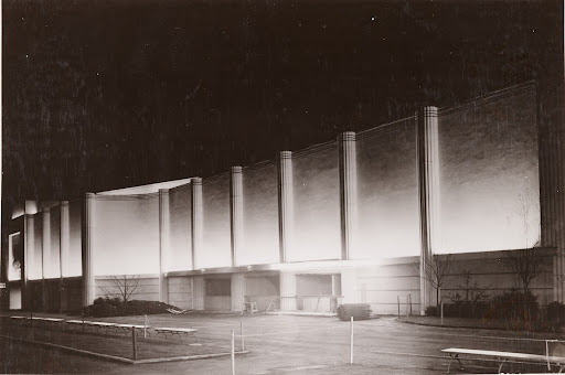 Flower-box strips, equipped with fluorescent lamps and reflectors, indirectly lighting half-columns of wall of home furnishings building facing avenue of patriots. At New York World's Fair