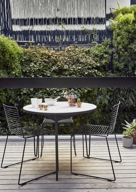 The courtyard can be found on a landing at the top of the stairs and makes full use of the vertical garden.