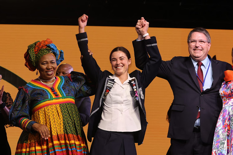 Basic education minister Angie Motshekga and Western Cape minister of education David Maynier congratulate the overall top pupil in public schools, Melissa Muller.