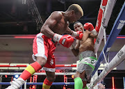 Gift Bholo is caught with a jab by Hannock Phiri on his way to a stoppage win at the Galleria in Sandton. 