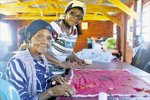 HELPING EACH OTHER: Nombulelo Pikoli with the founder of Emthonjeni Wokuphila for the elderly, Ntombozuko Ndamase, right, at their centre in KwaMxhalanga village near King William’s Town Picture: SIBONGILE NGALWA