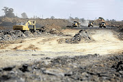 Heavy machines carve up the earth at the mine in Mpumalanga.