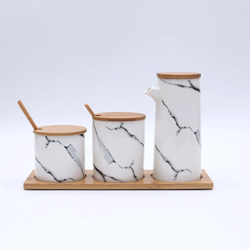 Pot à épices en céramique marbrée nordique. Rangement élégant et fonctionnel pour vos condiments. Gardez vos épices fraîches et à portée de main.