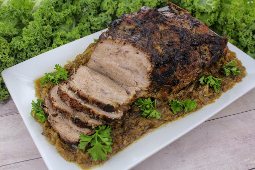 German style pot roast sliced with sauerkraut and onions.