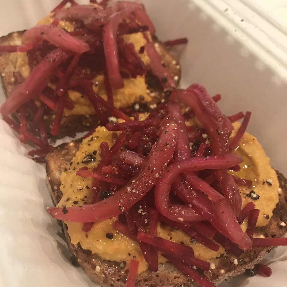 Spicy Carrot Humus toast with Beets & Pickled Red Onion. Mother Juice.