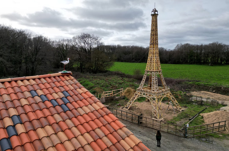 A drone view shows a 16-meter replica of the Eiffel Tower from recycled wood built by French carpenter Frederic Malmezac and Sylvain Bouchard.