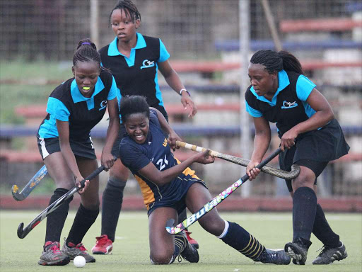 Rhoda Nyambura (C) fights Kenyatta University trio in past action/ File