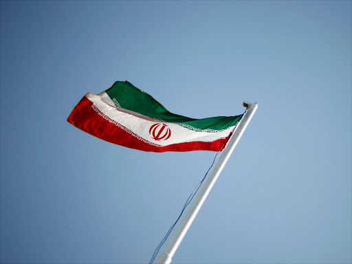 The Iranian national flag flutters during the opening ceremony of the 16th International Oil, Gas & Petrochemical Exhibition (IOGPE) in Tehran April 15, 2011. /REUTERS