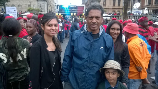 Gordon Cook and his children, Shaista and Shalin. AT the back To his left is his employee Elisha.