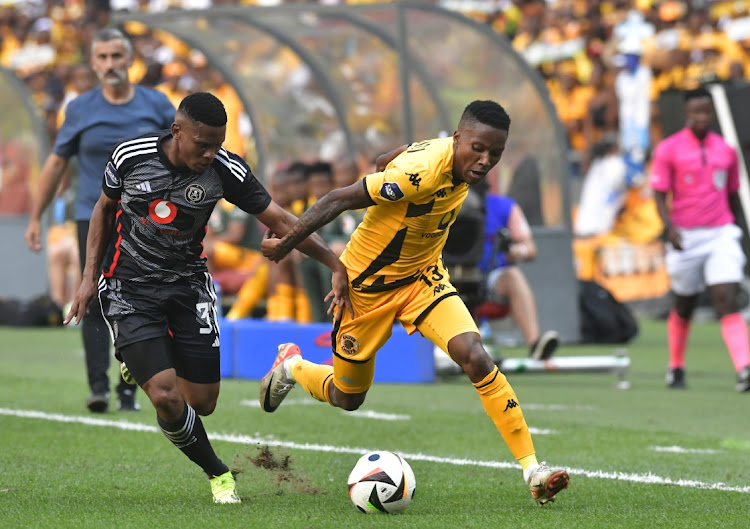 Pule Mmodi of Kaizer Chiefs and Thabiso Lebitso of Orlando Pirates compete for the ball during the Soweto derby at FNB Stadium on Saturday.