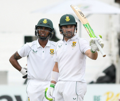 Proteas captain Dean Elgar raises his bat after he scored his 21st Test half century in the first session of the first Test against Bangladesh at Kingsmead Stadium on Sunday.