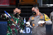 Officers show evidence of attacks by suspected supporters of Indonesian hardline cleric Rizieq Shihab, at Polda Metro Jaya, Jakarta, Indonesia, December 7, 2020.