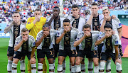 Germany's players cover their mouths in protest as they pose for their team photo ahead of their Fifa World Cup Group E match against Japan at Khalifa International Stadium in Doha, Qatar on November 23 2022.