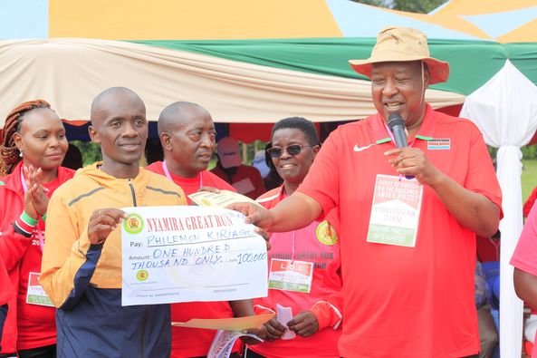 CAPTION; Nyamira Governor awards Philemon Kiriago during the Nyamira Great Run.