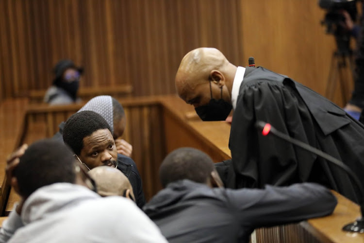 Advocate Malesela Teffo with the accused in the 2014 murder of Bafana Bafana goalkeeper Senzo Meyiwa during their trial in the North Gauteng High Court in Pretoria on May 30 2022.