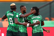 Nigeria's Ademola Lookman celebrates scoring their goal with teammates in the Afcon game against Angola .