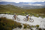 Lucien Besançon and Konny Looser from Switzerland race across Oak Valley in last month’s Cape Epic.