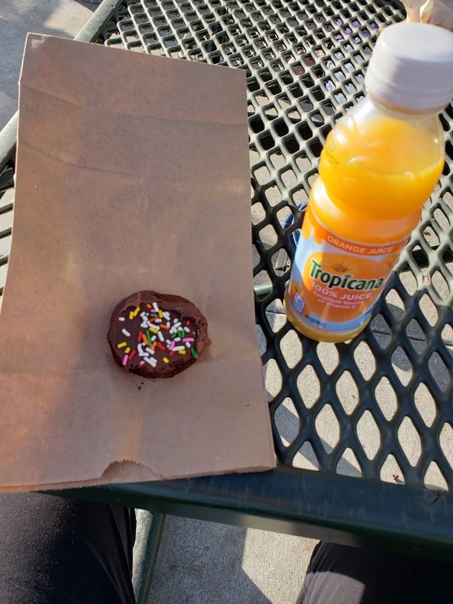 Chocolate donut, oj used for size comparison