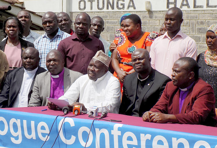 Shiekh Haji Abdi Wafula-SUPKEM addressing the press Kakamega on Wednesday. He is flanked from right by the Western NCCK chairman Rev. Benson Shisia, Catholic representative vicar general Kizito Sabatia, Interfaith chairman Bishop Nicholas Olumasai (in purple shirt and white collar) and other religious leaders.