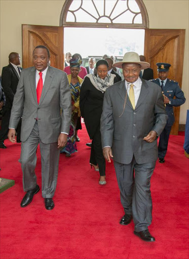 President Uhuru Kenyatta and Ugandan president Yoweri Museveni arriving at State House, Entebbe. Photo/PSCU