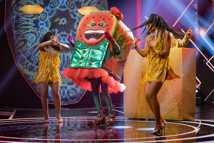 Watermelon performs on stage.